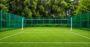 Outdoor badminton court showing the playing surface, boundary lines and net for a beginner’s court setup guide.
