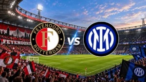 De Kuip stadium in Rotterdam under floodlights on a Champions League night before Feyenoord vs Inter, with red and white home stands